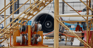Aircraft engine undergoing maintenance in an aerospace MRO facility