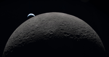 Moon surface viewed from space with Earth in the background